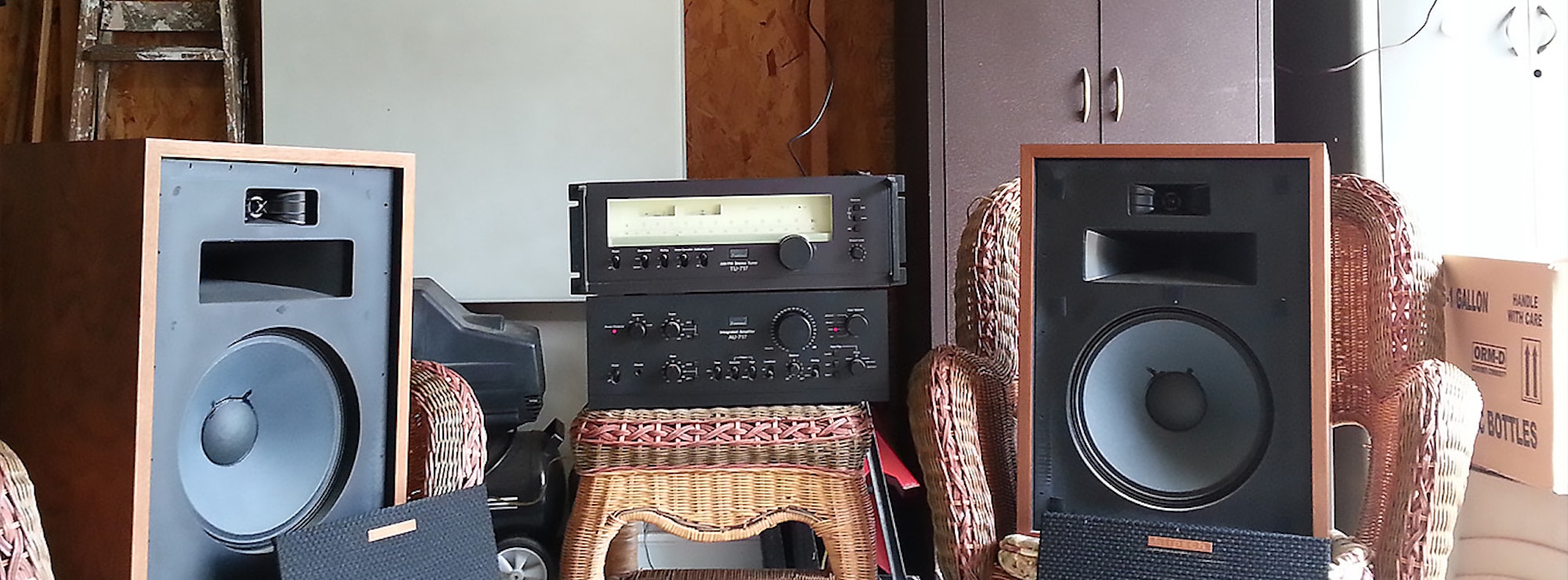 Two Heresy speakers in a garage